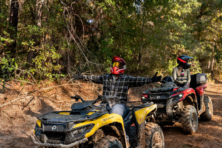 man leaning up on can-am outlander